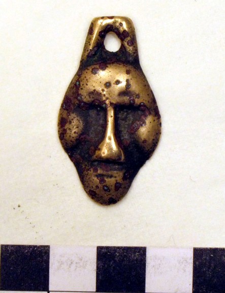 Ancient amulet in the form of a human face, reportedly discovered in Upper Tibet